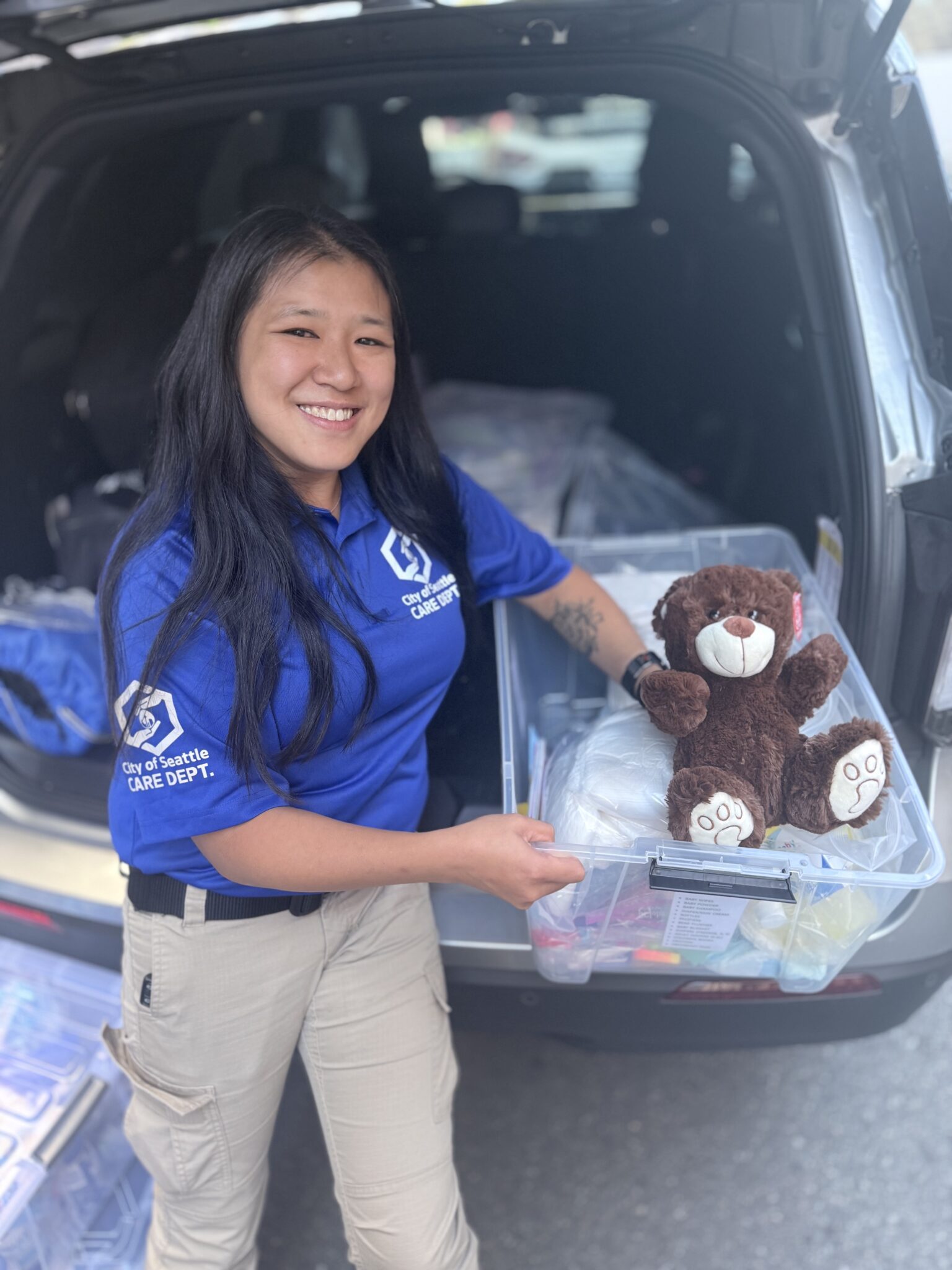 A CCR holding a teddy bear