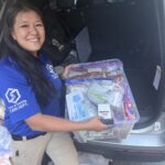 A CCR holding a bin of supplies, including dog food