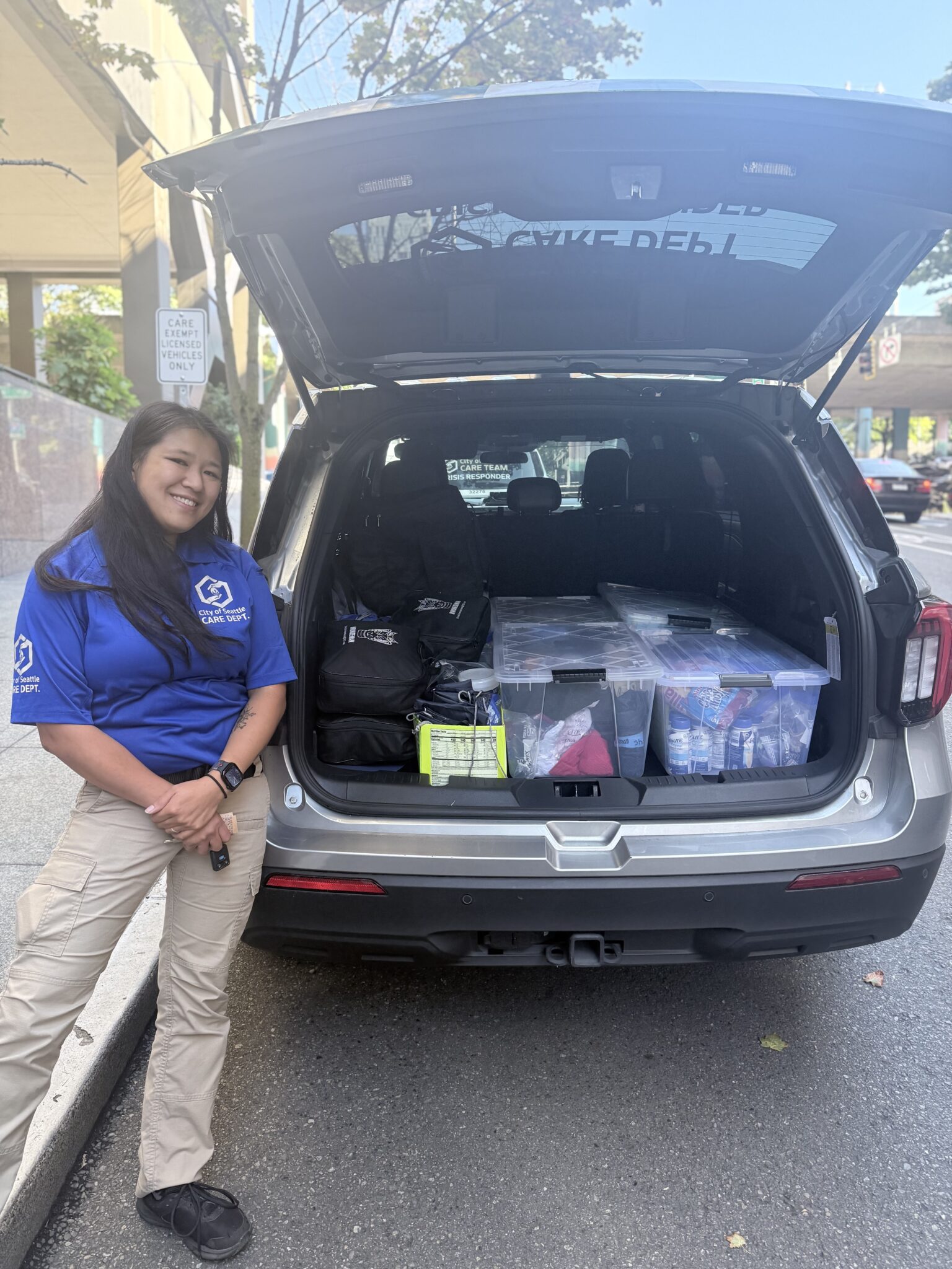 A CCR SUV and a CCR standing by an open CCR SUV